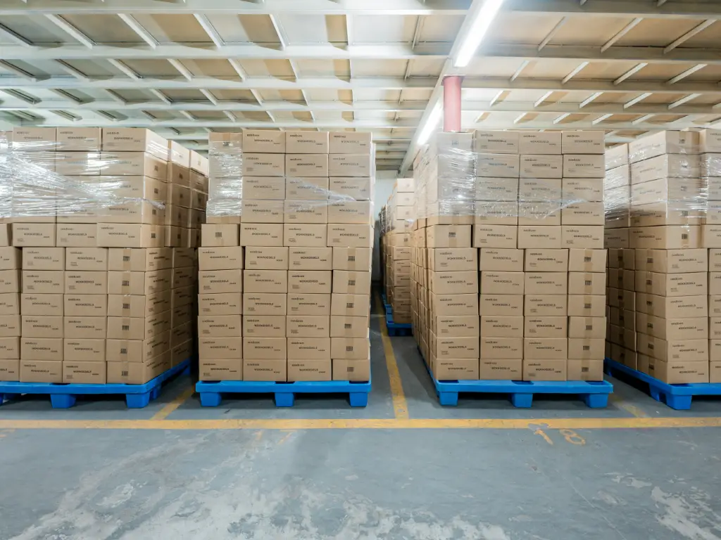 A batch of packaged organic noodles are neatly stacked in Kimdee's warehouse