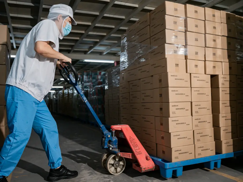 Kimdee employees drive forklifts to deliver goods