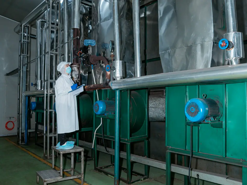 Kimdee worker monitor the machine while the noodles are being dried